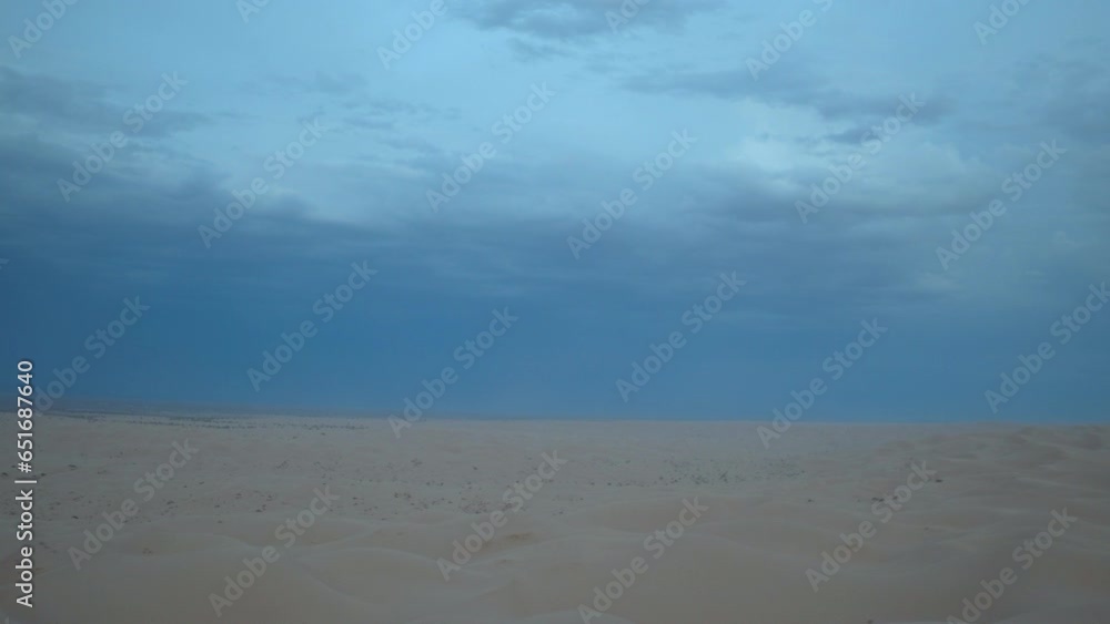 Aerial Tilt Up Shot Of Idyllic Desert Landscape Against Blue Sky At Sunset - Glamis, California Aerial Tilt Up Shot Of Idyllic Desert Landscape Against Blue Sky At Sunset - Glamis, California