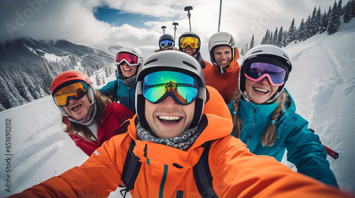 stockphoto, a group of people wearing ski equipment takes a selfie together. Group of friend during ski holiday taking a selfie. Togetherness, happy people.