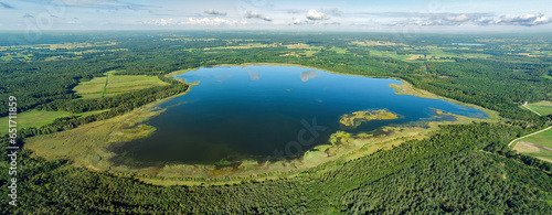 Aerial view of a lake in the forests of Lithuania, wild nature. The name of the lake is "Nedzingis", Varena district, Europe.