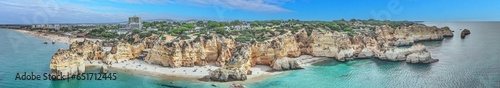 Panoramic drone picture over Praia do Marinha beach in Portuguese Algarve during daytime