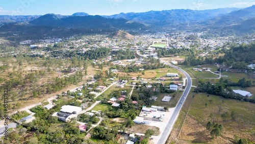 Aerial trip over a small town named Marcala with yellow sunset light photo