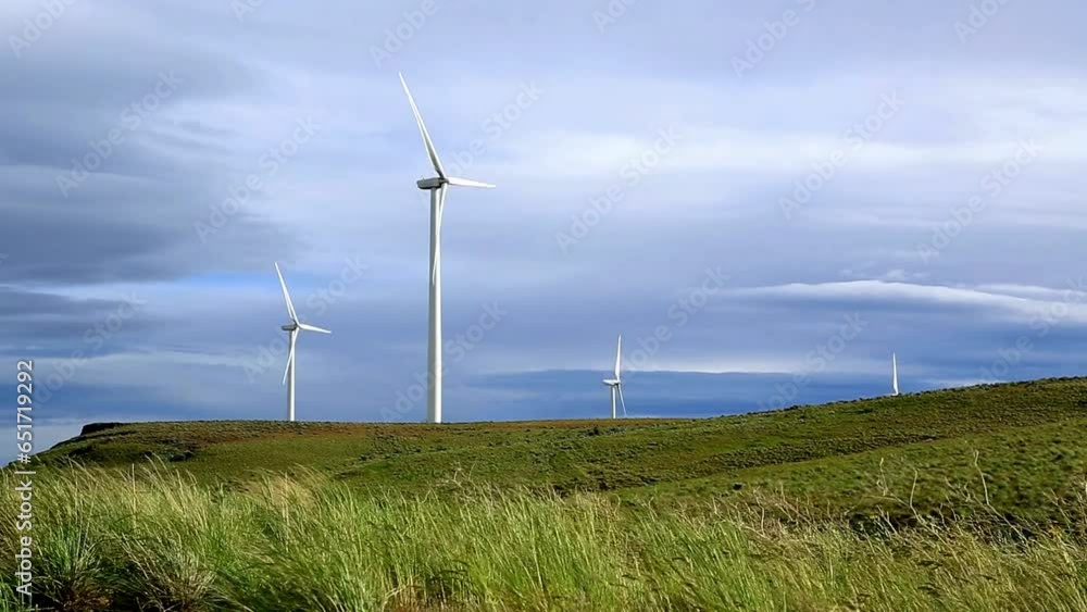 Wind Turbines on Wheat Field - 4K Video with Dramatic Cloudy Sky Wind Turbines on Wheat Field - 4K Video with Dramatic Cloudy Sky