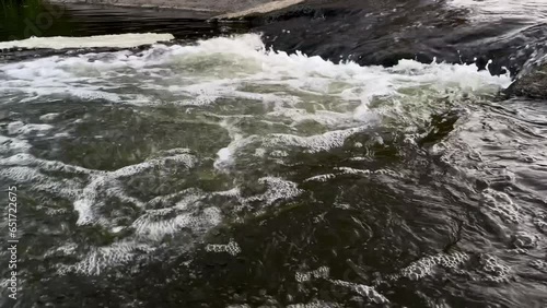 water flowing over rocks in summer