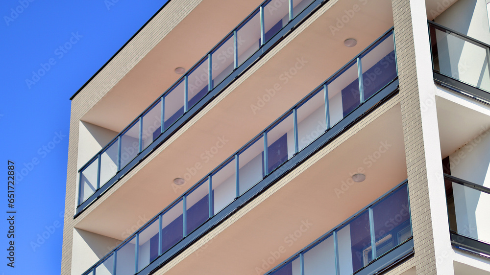 Modern luxury residential building. Modern apartment building on a sunny day. Facade apartment building with a blue sky. Modern luxury residential building. Modern apartment building on a sunny day. Facade apartment building with a blue sky.