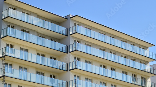  Modern luxury residential building. Modern apartment building on a sunny day. Facade apartment building  with a blue sky. 