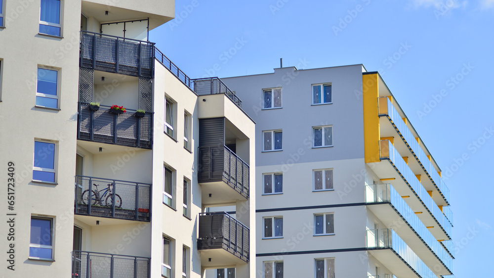 Modern luxury residential building. Modern apartment building on a sunny day. Facade apartment building  with a blue sky. 