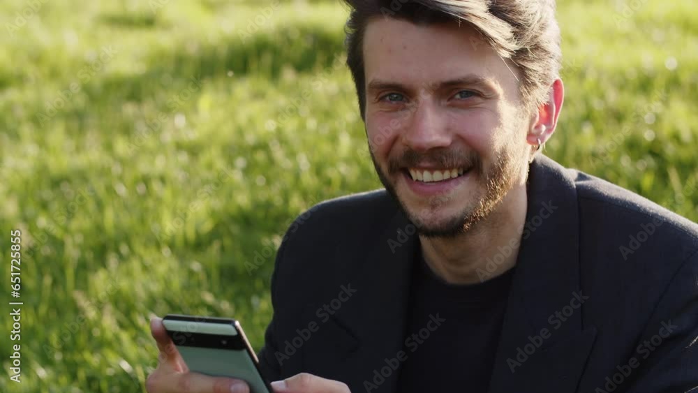 Video of businessman optimistic hold his smartphone chatting messenger app corporate group free time outdoor. Funny guy in suit laugh phone. Video of businessman optimistic hold his smartphone chatting messenger app corporate group free time outdoor. Funny guy in suit laugh phone.