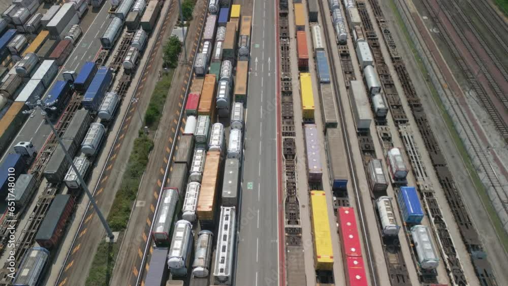 Aerial view of a road-rail transshipment terminal in Italy. The cargo begins its journey by train and is picked up by a truck to its final destination by road. Aerial view of a road-rail transshipment terminal in Italy. The cargo begins its journey by train and is picked up by a truck to its final destination by road.