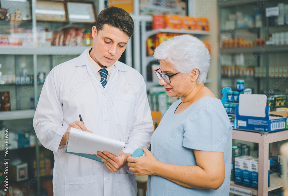 Pharmacist giving advice And advice for patients who come to buy Medicine, Drugs, Vitamins products, according to prescriptions in modern pharmacies. Pharmacist giving advice And advice for patients who come to buy Medicine, Drugs, Vitamins products, according to prescriptions in modern pharmacies.