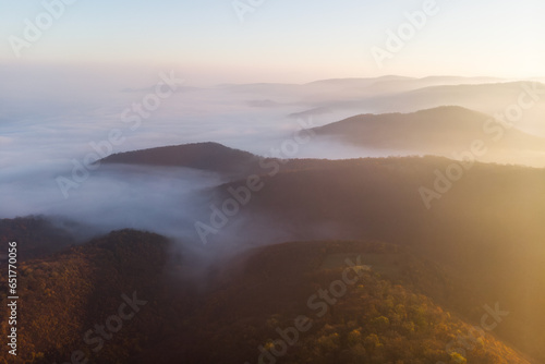 Majestic sunrise over misty mountain range