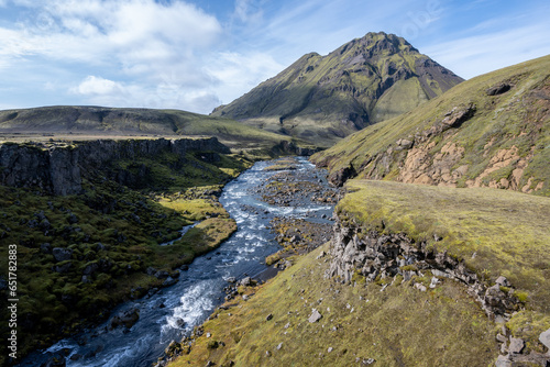 River amidst volcanic landscape of Fjallabak Nature Reserve in Icelandic highlands on sunny autumn afternoon.. © Francisco