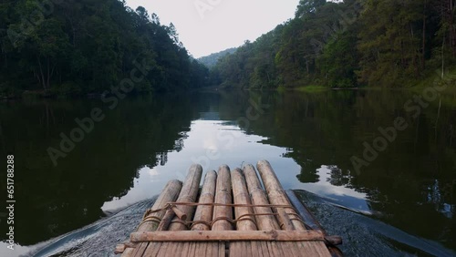 POV on a bamboo rafting boat on a lake in Thailand