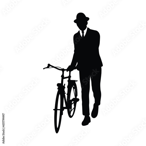 Gentleman pushing a bicycle in a park