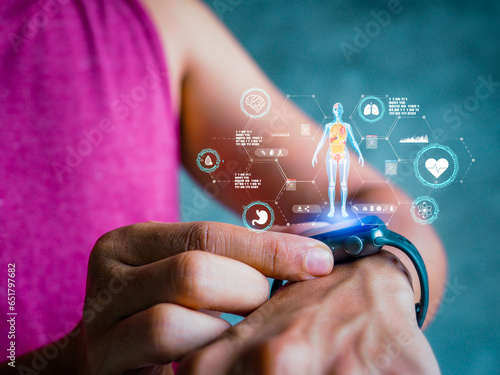 Mid adult man using smart watch during training. Heart monitor beats with wristwatch. smart watch or future data on healthcare. technology in use of smart watch for health condition.