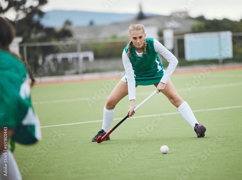 Field, hockey and woman in sports, game or action in competition with ball, stick and team on artificial grass. Sport, teamwork and women play in training, exercise or workout for goals in match
