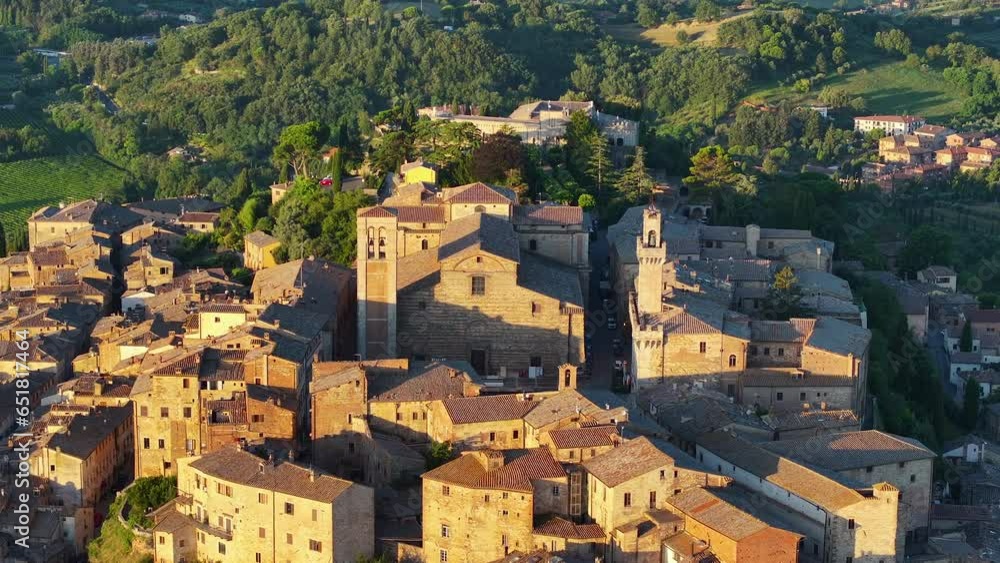 Montepulciano at sunrise, aerial view showcasing the Cathedral of Saint Mary of the Assumption and Palazzo Comunale in the Tuscany hills of Siena Province, Italy Montepulciano at sunrise, aerial view showcasing the Cathedral of Saint Mary of the Assumption and Palazzo Comunale in the Tuscany hills of Siena Province, Italy
