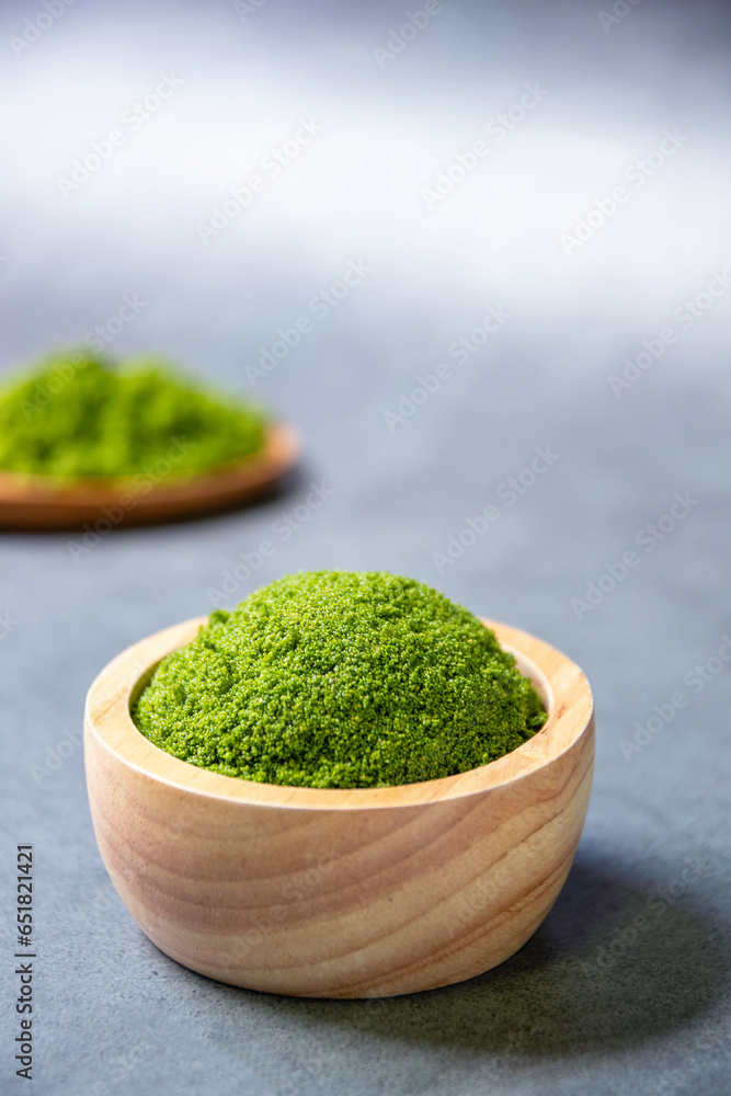 Wolffia globosa in wooden bowl. Wolffia is the nutrient-rich plant-based source of protein and omega3 and vital minerals like zinc, calcium, iron, B12 and so much more. Wolffia globosa in wooden bowl. Wolffia is the nutrient-rich plant-based source of protein and omega3 and vital minerals like zinc, calcium, iron, B12 and so much more.