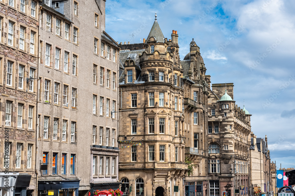 Facades of historic buildings on the busy Royal Mile of the city of Edinburgh, Scotland