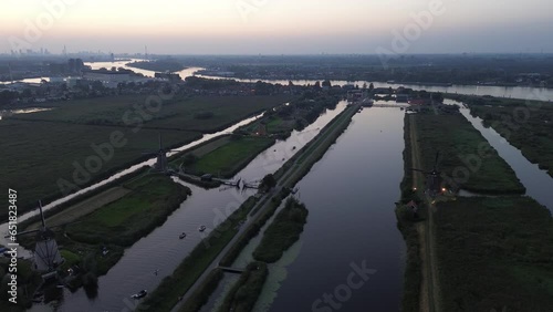 Wallpaper Mural Beautiful view from above. Beautiful wooden windmills at sunset in the Dutch village of Kinderdijk. Windmills run on the wind. The beautiful Dutch canals are filled with water. Torontodigital.ca