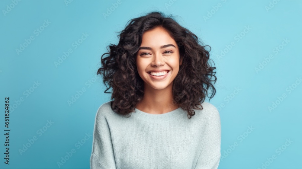 In a world of her own happiness, a young girl's smile takes center stage against a minimalist studio setting. In a world of her own happiness, a young girl's smile takes center stage against a minimalist studio setting.