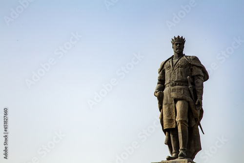 statue of Timur in Uzbekistan Khiva from The Middle short with the light blue sky with cloudy weather in a summer season in the evening time right side empty space