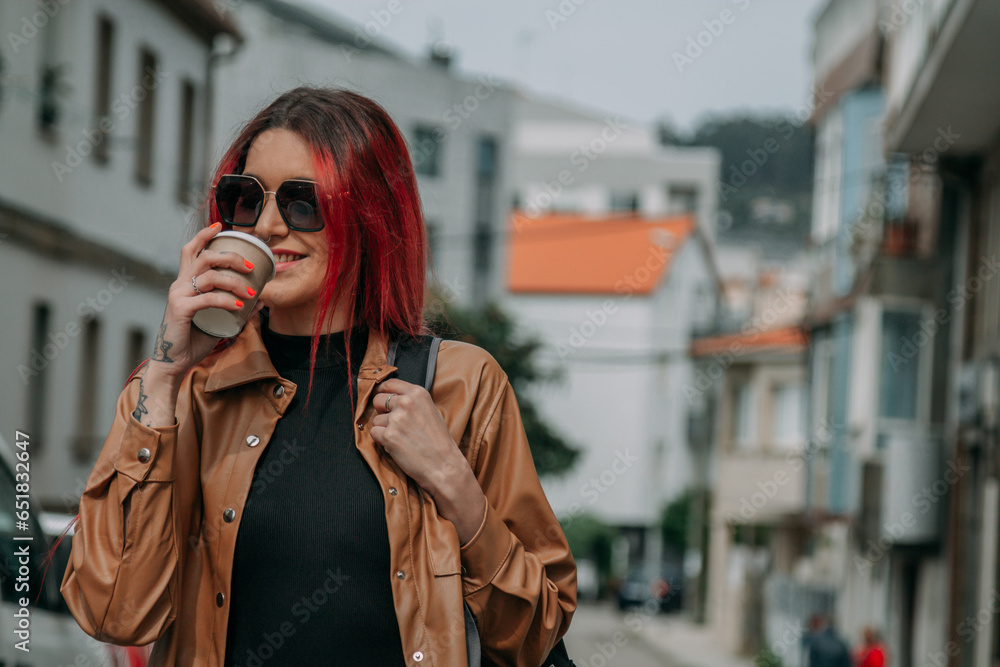 urban woman having a coffee on the street