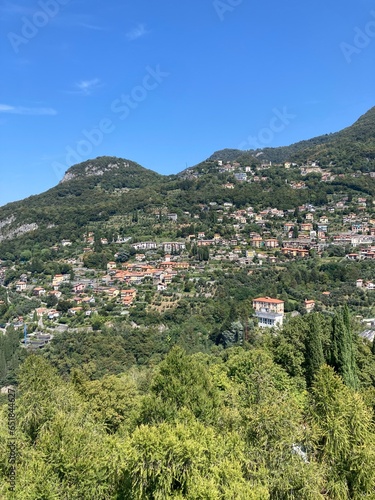 Colourful amazing facades of Italy buildings in the lake, river, sea and in the city center. Sunny day in Italy. Sightseeing in Milano, Genoa, Varenna, Bergamo, Lake Como. Old buildings Italy and sky
 photo