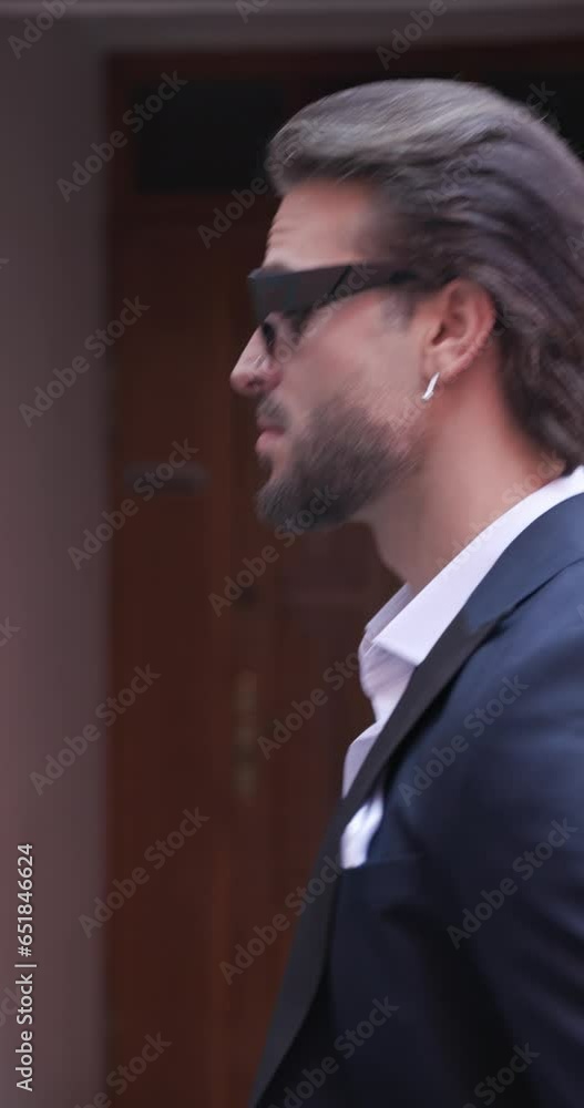 project video of elegant fashion man looking behind, climbing stair and fixing sunglasses while walking outdoor in an old town from Romania project video of elegant fashion man looking behind, climbing stair and fixing sunglasses while walking outdoor in an old town from Romania