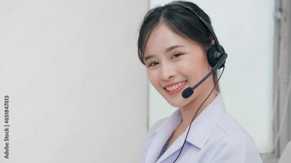 Asian woman call center in service talking with customer by phone via headset to give advice health at hospital. Hot line healthcare. Asian woman call center in service talking with customer by phone via headset to give advice health at hospital. Hot line healthcare.