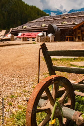 Old agricultural device with a steel wheel at Mount Klausberg, Ahrntal valley, Pustertal, Trentino, Bozen, South Tyrol photo