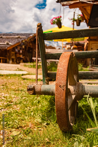 Old agricultural device with a steel wheel at Mount Klausberg, Ahrntal valley, Pustertal, Trentino, Bozen, South Tyrol photo