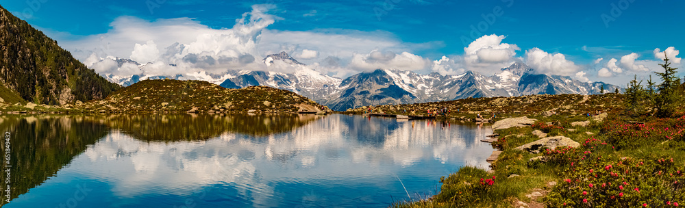 High resolution stitched alpine summer panorama with reflections at Lake Klaussee, Mount Klausberg, Ahrntal valley, Pustertal, Trentino, Bozen, South Tyrol