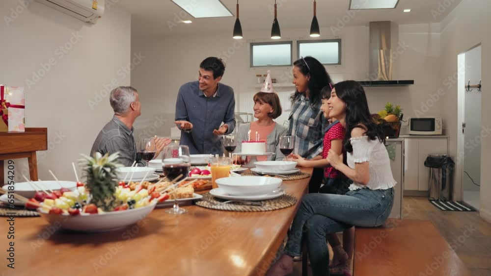 Big family celebrating grandmother birthday at the dining table in the house Big family celebrating grandmother birthday at the dining table in the house