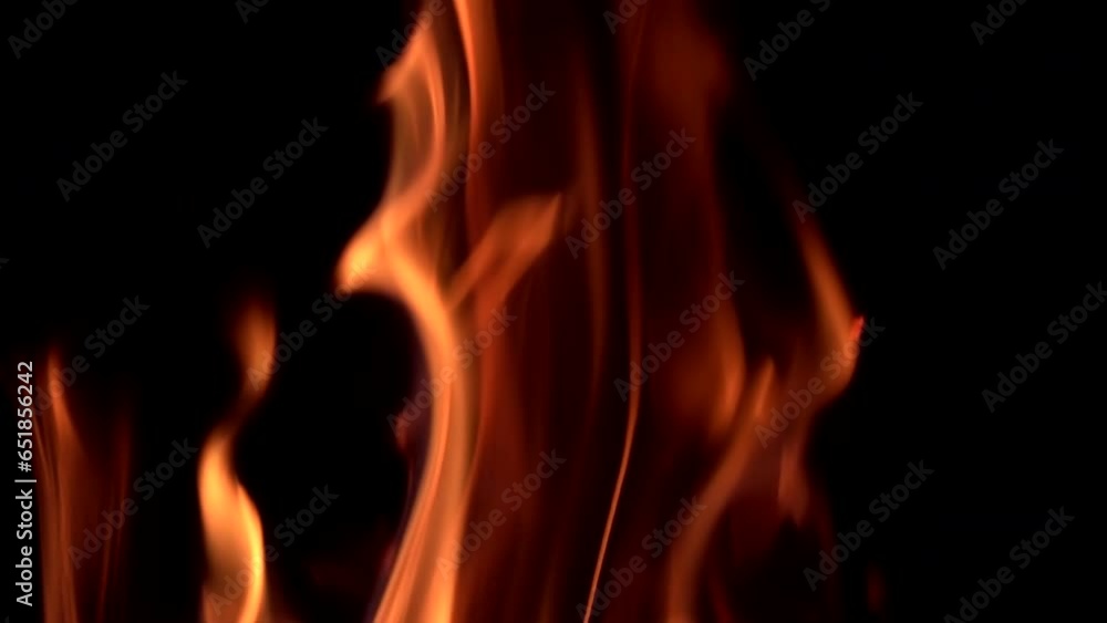 Fire burning in night on isolated black background. Loopable, yellow and orange color flame giving, light, detail, red, falmes, nature, dark, slow motion, motion, mid shot, close up, hd. ProRes 422HQ. Fire burning in night on isolated black background. Loopable, yellow and orange color flame giving, light, detail, red, falmes, nature, dark, slow motion, motion, mid shot, close up, hd. ProRes 422HQ.