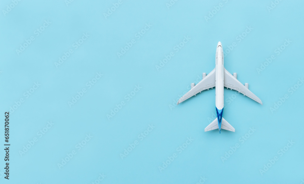 A plane miniature isolated on blue background, after some edits. A plane miniature isolated on blue background, after some edits.