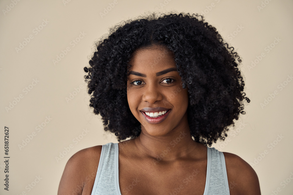 Φωτογραφία Young adult African American woman beauty female model, pretty 20s Black lady with curly hair beautiful face healthy skin looking at camera isolated at beige background