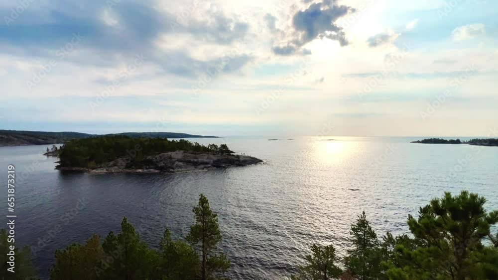 Russia, Karelia, Lake Ladoga, Koyonsaari. View of the coast of the island in a cold lake. Beautiful nature of the Republic of Karelia. Stunning panoramic view of the Ladoga Skerry Islands. 4K Russia, Karelia, Lake Ladoga, Koyonsaari. View of the coast of the island in a cold lake. Beautiful nature of the Republic of Karelia. Stunning panoramic view of the Ladoga Skerry Islands. 4K