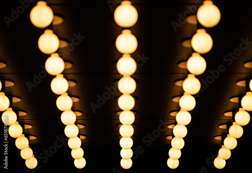 Rows of illuminated globes under the marquee, as often used at the entrance to theatres and casinos photo