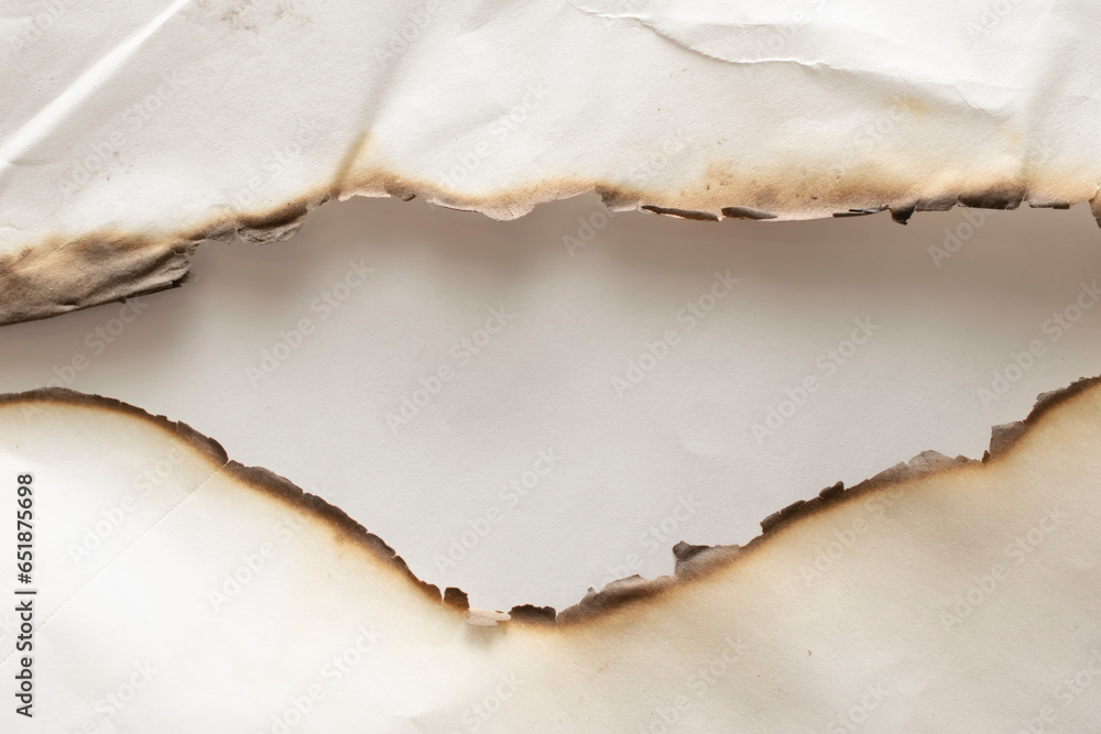 Fototapeta premium scorched sheets of white paper