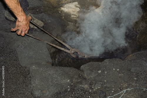 Ferron working in the forge of the El Pobal ironworks photo