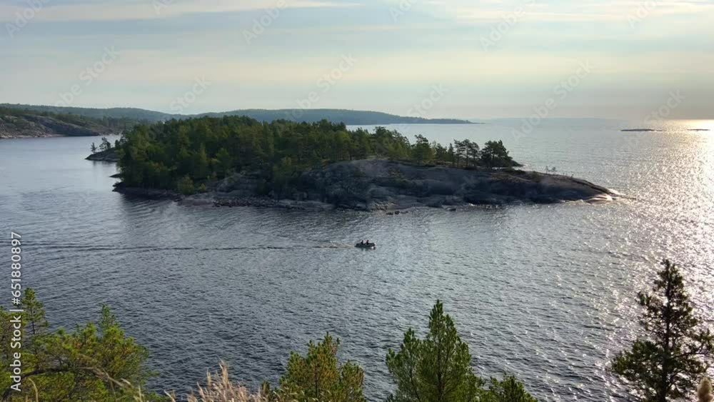 Russia, Karelia, Lake Ladoga, Koyonsaari. View of the coast of the island in a cold lake. Beautiful nature of the Republic of Karelia. Stunning panoramic view of the Ladoga Skerry Islands. 4K Russia, Karelia, Lake Ladoga, Koyonsaari. View of the coast of the island in a cold lake. Beautiful nature of the Republic of Karelia. Stunning panoramic view of the Ladoga Skerry Islands. 4K