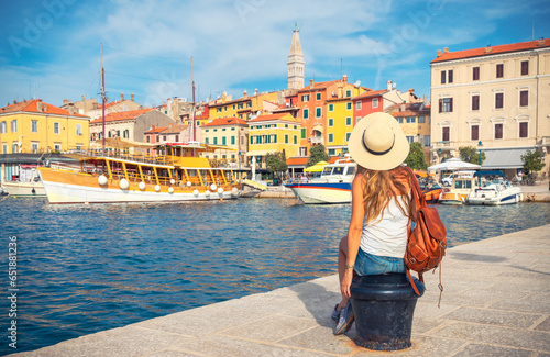 Bild auf Leinwand Rear view of woman traveler in Croatia- Rovinj city and adriatic sea-Istria
