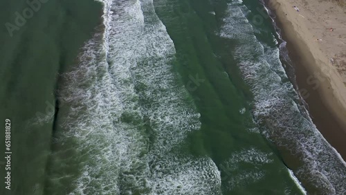 Marina di Vecchiano Pisa Tuscany Italy aerial view of waves crashing on the beach photo