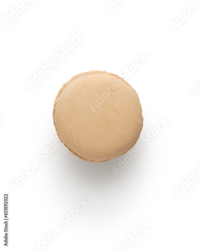Beige french macaron top view isolated on white with shadow