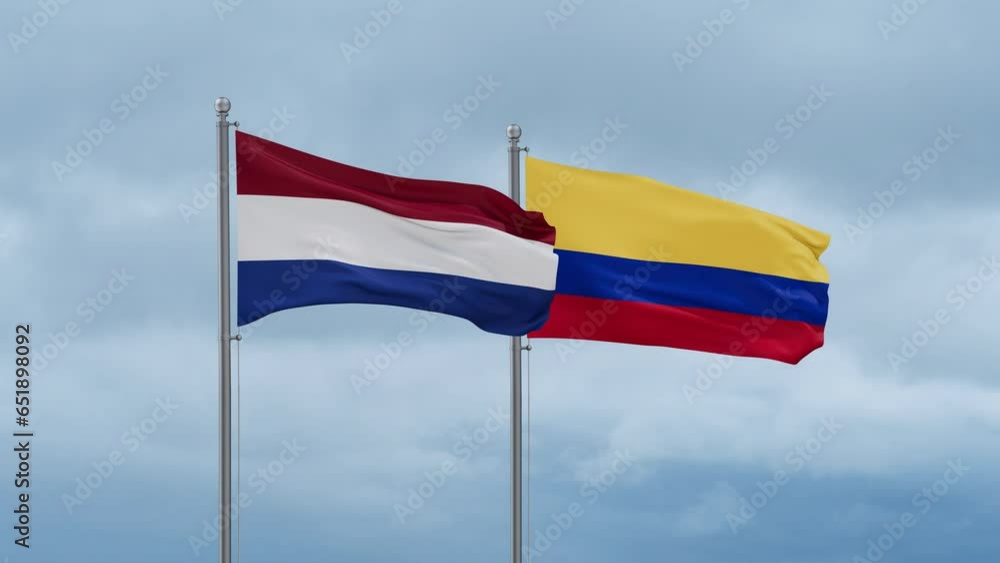 Colombia and Netherlands flag waving together on cloudy sky, endless seamless loop, two country cooperation concept Colombia and Netherlands flag waving together on cloudy sky, endless seamless loop, two country cooperation concept