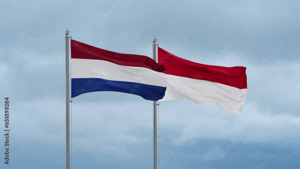 Indonesia flag and Netherlands flag waving together on cloudy sky, endless seamless loop, two country relations concept Indonesia flag and Netherlands flag waving together on cloudy sky, endless seamless loop, two country relations concept