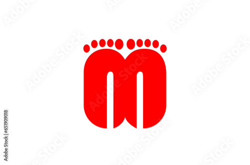 M letter with Lord laxmi footprints in red color. photo