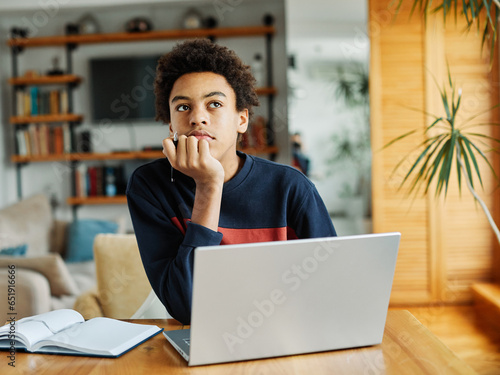 education laptop student teenager studying boy learning homework idea thinking dreaming student thoughtful looking education inspiration study young school photo