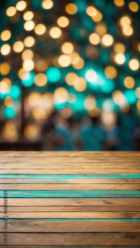 The empty wooden table top with blur background of bokeh lights. Exuberant image.