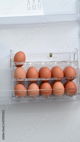 Stacked eggs together. Tray with eggs.